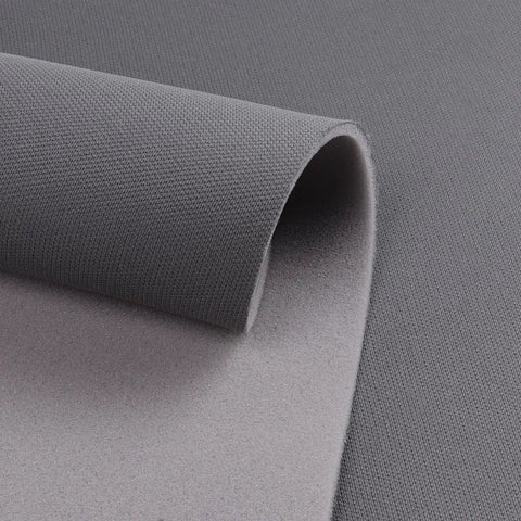 Close-up of Dark Gray 60 Inch By 76 Inch Mesh Headliner Fabric With Foam Backing For Auto, showing textured material and foam backing.