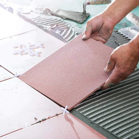 Installation using Wide Tile Spacers And Levelers 1/16 Inch Pack Of 500 For Ceramic Tile And Stone, hands placing tiles.