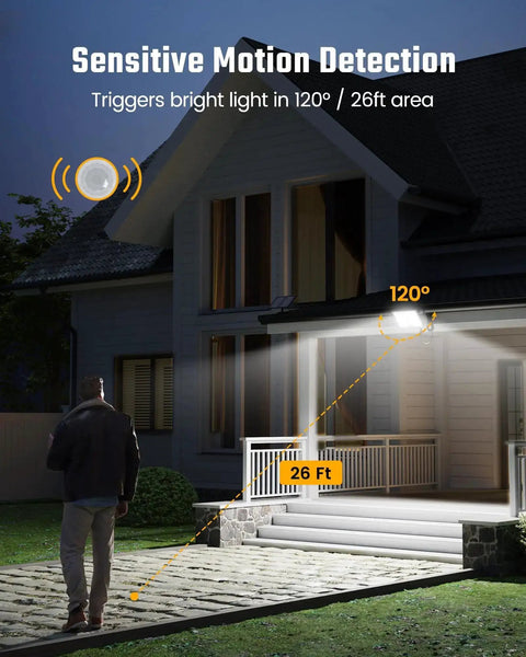 Solar Outdoor Motion Lights With 113 LEDs 7000K Cool White Flood illuminating a home's porch and pathway at night with motion detection.