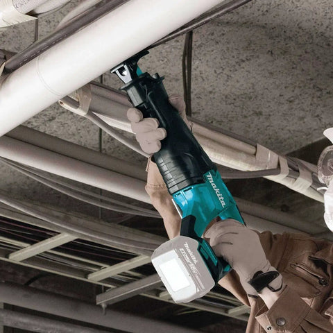 Worker using 18V LXT Brushless Cordless Reciprocating Saw Tool Only With Variable Speed Trigger And Toolless Blade Change for piping