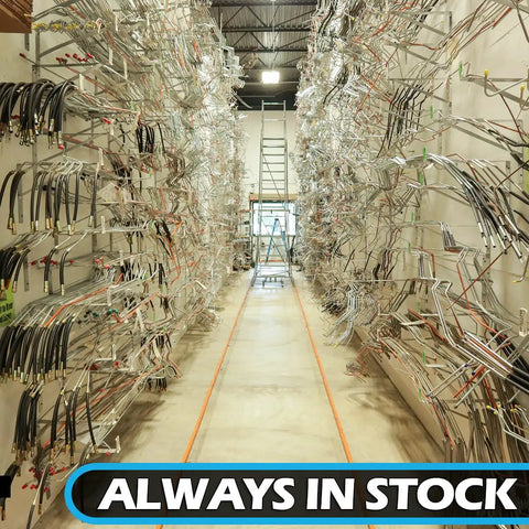 Inline Tube stainless braided hose, 33 in, 7/16 banjo to 3/8-24 female, displayed on warehouse racks