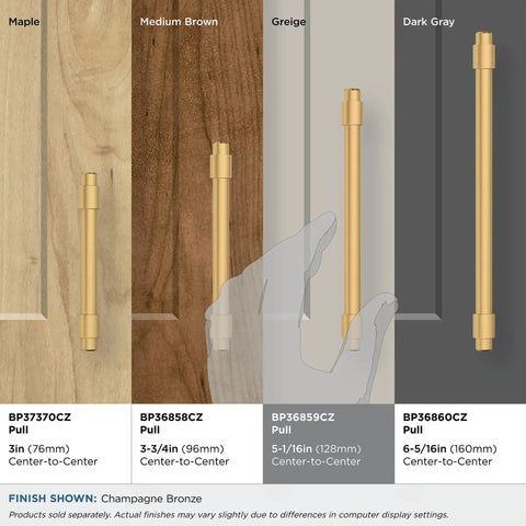 Champagne Bronze Destine Cabinet Pull 5-1/16 Inch Center-To-Center, 6-3/16 Inch Overall Length, shown on various wood finishes.