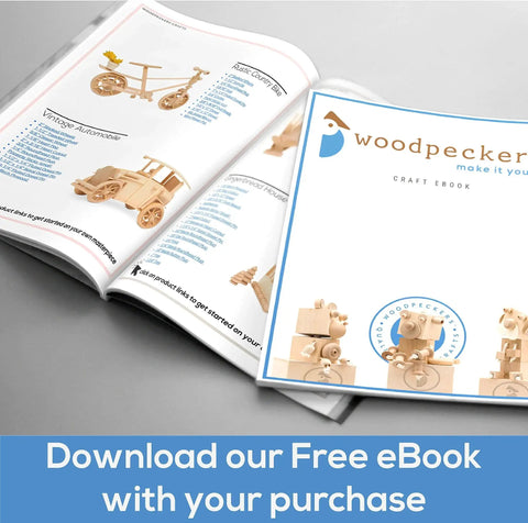 Open Woodpecker craft eBook with wooden toy designs and text 'Download our Free eBook with your purchase'