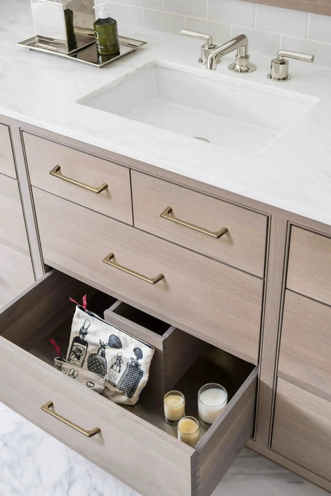 Antique Brass Cabinet Pulls 5 Inch Hole Centers 128mm Zinc Alloy Handles installed on wooden drawers in kitchen setting