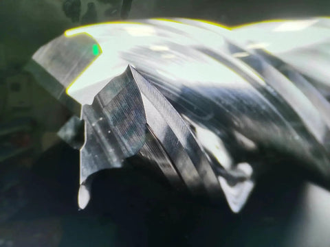 Close-up of high finishing carbide end mill for aluminum and copper cutting with U type design square milling cutter, 3-flute.