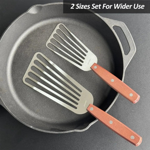 2 Pack Fish Spatula Turner Set Stainless Steel Slotted Spatulas For Flipping Turning Frying And Grilling 3 By 6 Inch And 4 By 8 Inch With Wooden Full Tang Handle And Curved Beveled Blade on skillet