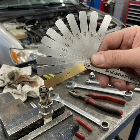 Stainless Steel Feeler Gauge Set For Spark Plugs With 32 Blades From 0.04 To 0.88 Mm Gap Tool Filler Gauge in use in garage
