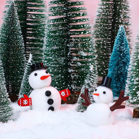 Snowman figures with carrot noses, top hats, and glove buttons from Massive Christmas Craft Button Kit With 450 Pieces Including Carrot Noses Tiny Black Buttons Mini Plastic Top Hats Glove Buttons And White Snowflake Buttons For DIY Ornaments And Holiday Decor in a snowy forest scene