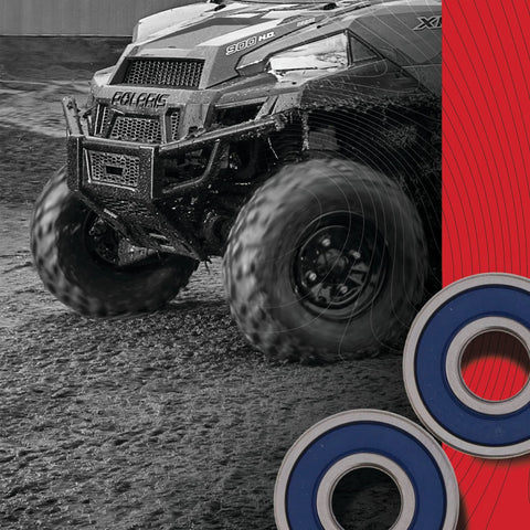 Off-road vehicle with mud-splattered tires next to Premium Drop-In Wheel Bearing Kit For Honda With Type TC Double Bearings ABEC3