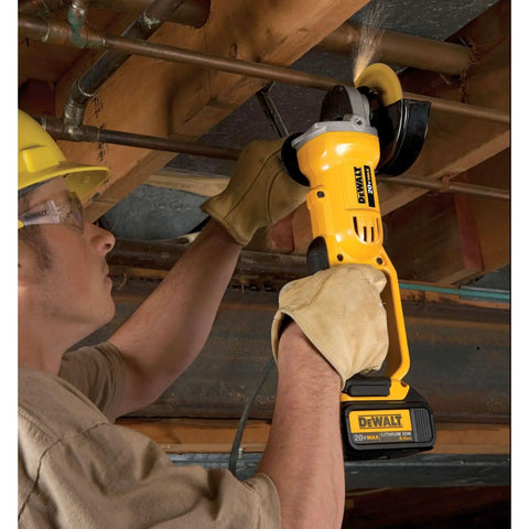 Using a Cordless 4-1/2 Inch Angle Grinder With 8,000 RPM Motor for cutting metal pipes. DEWALT DCG412B tool only in action.