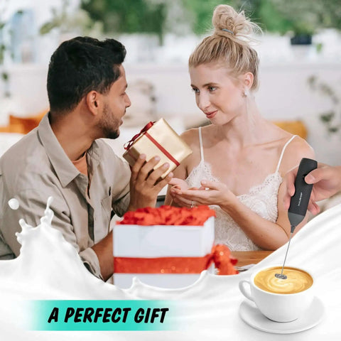 Rechargeable Milk Frother Wand Handheld Electric Foam Maker With USB C Power Detachable Stainless Steel Whisk For Coffee Latte Cappuccino Matcha No Stand Travel Ready Black shown in gift setting with a coffee cup and a couple exchanging gifts