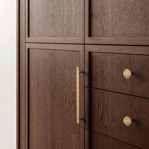 Champagne Bronze Cabinet Knobs Set 1.1 Inch Diameter Zinc Alloy Drawer Pulls installed on brown wooden cabinets.