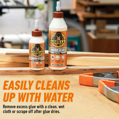 Two bottles of wood glue in a workshop setting, labeled Wood Glue 8 Ounce Bottle Natural Wood Color Indoor and Outdoor Water Resistant Bond