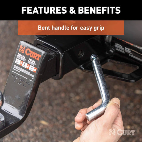 Hand holding Trailer Hitch Pin And Clip With Grooved Head No Fuss Five Eighth Inch Diameter Fits Two Or Two And A Half Inch Receiver
