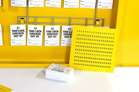 Interior of Lockout Tagout Cabinet Kit with tags and labels, double wide yellow for safe padlock storage, meets OSHA standards.