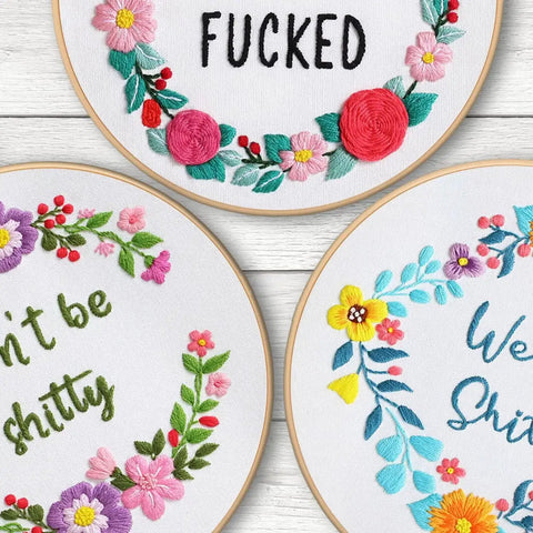 Three Sets Of Funny Embroidery Kits For Beginners With Flower Wreath Pattern And Funny Words Pattern DIY Easy Cross Stitch And Needlepoint Starter Kit For Adults Includes Clear Instructions And Colorful Threads, showcasing colorful hoops with floral wreath designs and humorous phrases.