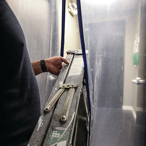 E-Z UP magnetic dust containment door kit on a clear plastic tent wall with blue edging; ladder inside
