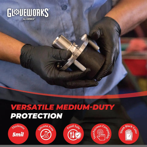 Person wearing Black Nitrile Gloves 5 Mil For Cooking Food Prep Disposable Large Box Of 100 while holding a metal part