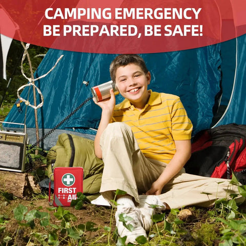 Boy camping with Compact 175 Piece First Aid Kit With Reflective Bag Design For Travel Home Office And Vehicle Use Includes Instant Cold Pack Emergency Blanket And Easy Grab Carry Pouch General Medi