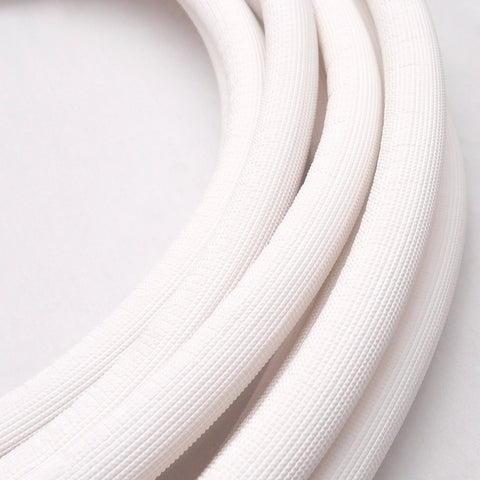 Insulated copper coil line tubing with white 1/2-inch insulation, HVAC refrigerant use, Amazon brand.