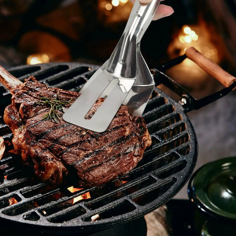 Multifunction 11 Inch Premium Stainless Steel Tongs 3 In 1 Gripper Flip And Scraper lifting steak on grill