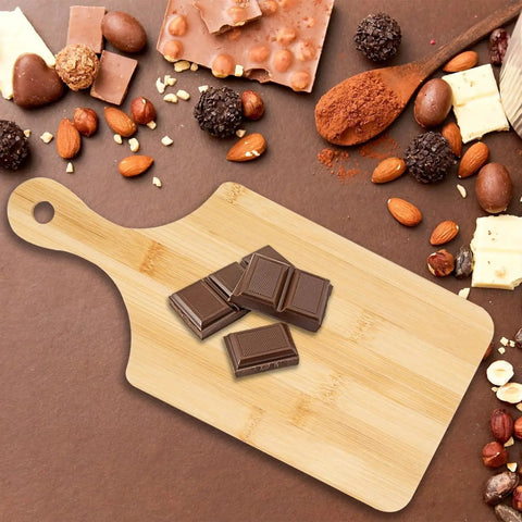 Bulk 25 Pack Mini Charcuterie Boards Set For Pizza Bread Cheese Fruit And Serving Bamboo Cutting Boards With Handle 11 By 5 Inch Laser Engraving Ready Great For Gifting DIY Projects Eco Friendly Kitchen Essentials with chocolate and nuts displayed on board