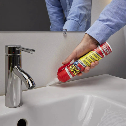 Person using Waterproof Hybrid Caulk Sealant Paintable Indoor Outdoor No Caulk Gun Needed on sink joint