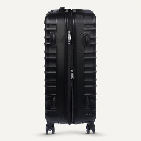 Side view of Big 30 Inch Hardside Checked Luggage With Four Spinner Wheels Scratch Resistant Shell Expandable Up To 15 Percent For Extra Packing Space