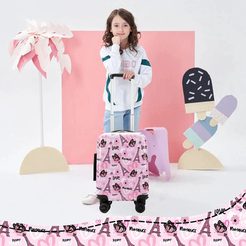 Young girl with pink Kids 16 Inch Hardside Luggage Set With Spinner Wheels, featuring colorful graphics, in a playful setting.