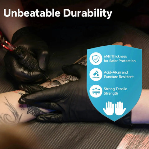 Tattoo artist wearing Nitrile Gloves Heavy Duty 6 Mil Disposable Black For Cooking XL during a session, showing durability and grip.