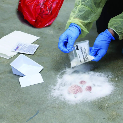 OSHA Compliant All In One Bloodborne Pathogen Cleanup Kit With 23 Pieces In Plastic Case being used to clean spill on floor with powder