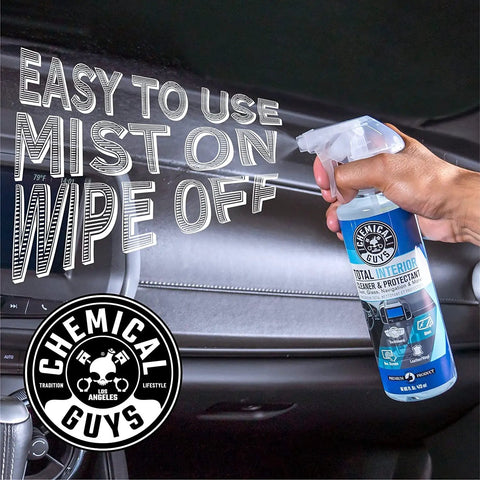 Hand holding a spray bottle of All In One Interior Cleaner And Protectant For Your Ride And All Vehicles Cars Trucks SUVs Motorcycles RVs And More Safe On Leather Vinyl Plastic Carpet Cloth Glass Wood Fresh Scent By Chemical Guys.