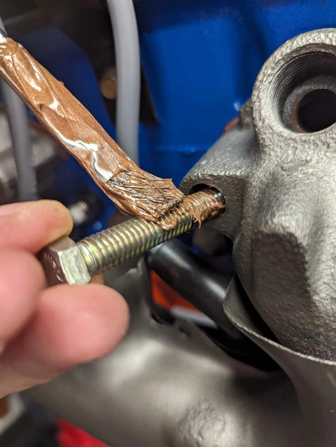 Copper Anti Seize Lubricant For Automotive Threads And Fasteners applied to bolt for exhaust manifold installation