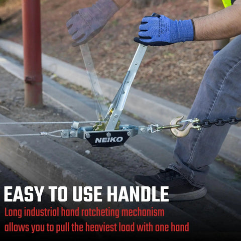 Person using 1 Ton Come Along Winch With Dual Gears And 5.9 Ft Cable, 2 Hooks for pulling heavy load on street.