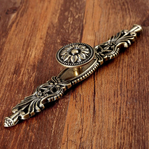 Vintage Cabinet Pulls Set of 5 in Antique Bronze on wooden surface showing detailed design and craftsmanship with 3.7 inch hole spacing
