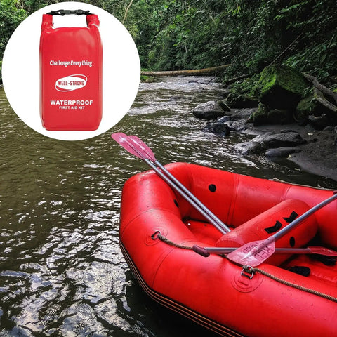 Red Waterproof Roll Top First Aid Kit for boats and outdoor adventures next to a red inflatable raft on a river