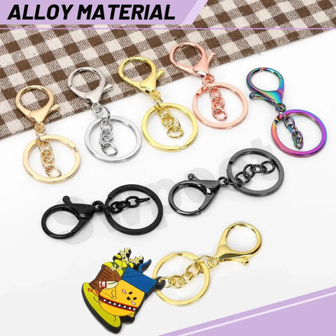 28Pcs 7 Color Lobster Claw Clasps With Key Chain And Flat Split Keychain Ring Set For Purses, Bags And DIY Crafts, Includes 68mm Clasp Length And 30mm Ring Diameter In Vibrant Colors displayed on fabric background.
