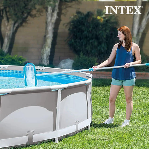 Woman using Deluxe Above Ground Pool Maintenance Kit With Vacuum For 800 GPH Flow Rate 110 Inch Telescoping Pole Wall Brush