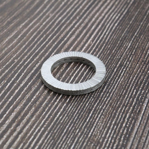 Wedge lock washer, manganese steel, serrated outer edge, front view.