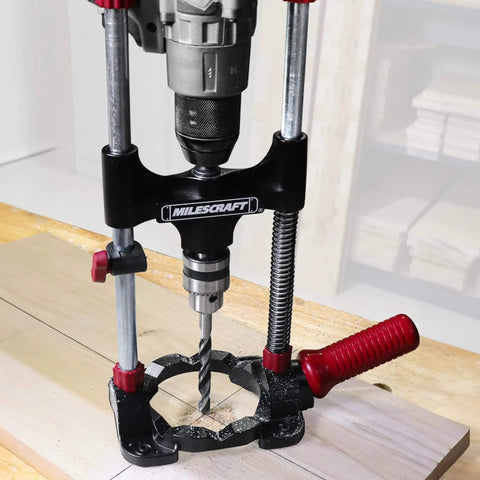 Portable Drilling Guide Attachment For Straight And Angled Holes With Adjustable Angle Readout, Fits Most 3/8 And 1/2 Inch Cordless Drills, Includes 3/8 Inch Chuck And Key, DIY Friendly Jig For Precise, Pro Grade Drilling attached to a drill.