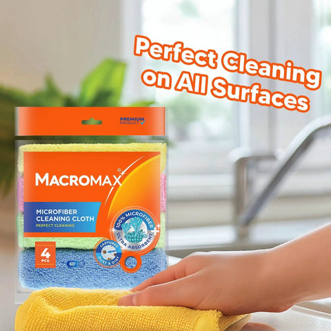 Close-up of hand using Pack Of 4 Ultra Absorbent Microfiber Cleaning Cloths For Kitchen Glass Counters, package visible in background