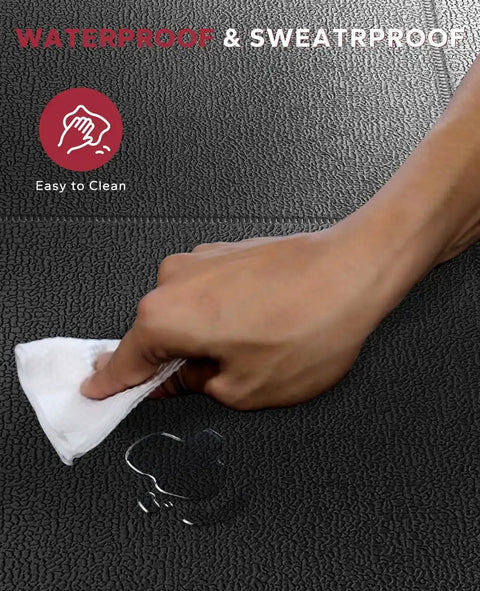 Hand wiping waterproof and sweatproof non slip treadmill mat for home gym setup, showing easy cleaning surface