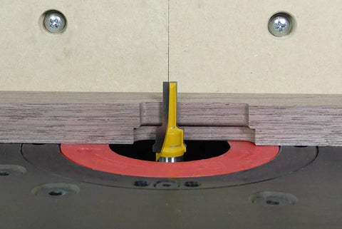 Zeroplay Two Step Plunge Router Bit with Half Inch Shank, Fourteen Inch Length for woodworking, installed in router table.