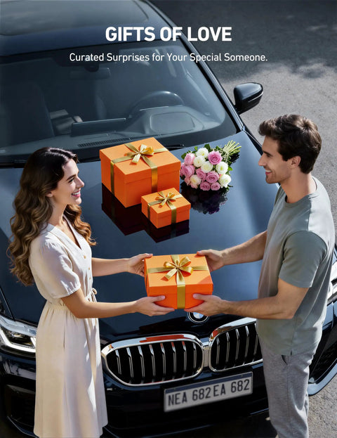 Couple exchanging gift boxes on car hood, with flowers nearby, symbolizing thoughtful giving.