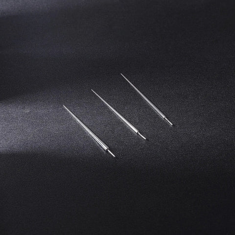 Three Two Piece G23 Titanium Insertion Pin Tapers for Nose Ear Navel Lip Piercings Kit 18G to 14G on black surface