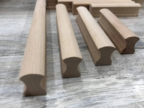 Six Unfinished Beech Wood Furniture Pull Handles Set For Cabinets And Drawers, array of unpainted wooden pulls on wood surface