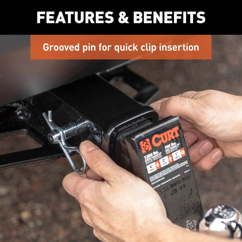 Person inserting Trailer Hitch Pin And Clip With Grooved Head No Fuss Five Eighth Inch Diameter Fits Two Or Two And A Half Inch Receiver