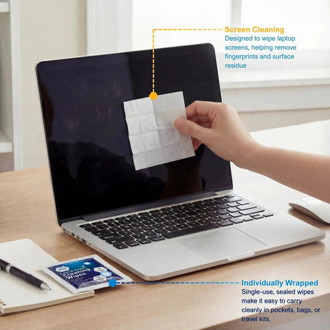 Person cleaning laptop screen with Anti Fog Lens And Screen Cleaning Wipes For Eyeglasses And Devices Premoistened
