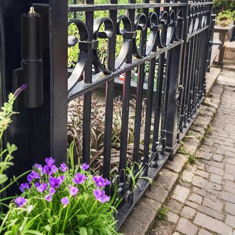 Beefy 7 Inch Barrel Style Gate Hinges For Weld On Install on black metal gate with purple flowers