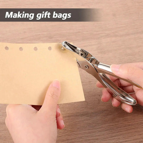 Person using Dope 20 Pack One Quarter Inch Single Hole Punch Set for making gift bags, showcasing metal hand paper puncher and punched paper.